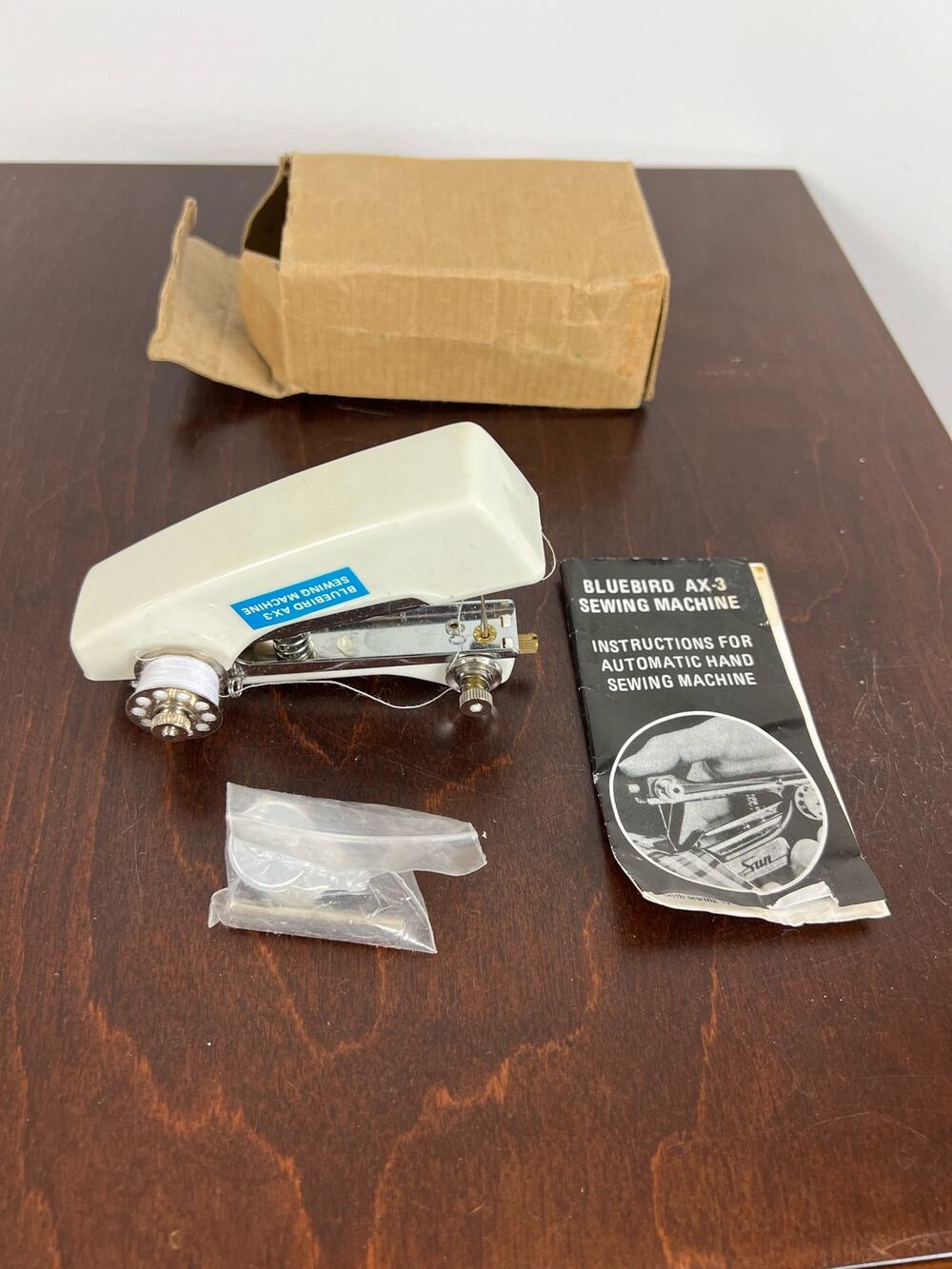 New in box Vintage handheld BlueBird AX-3 Sewing Machine